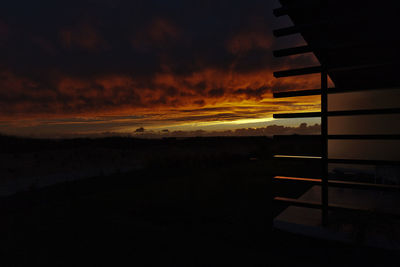 Scenic view of dramatic sky at sunset