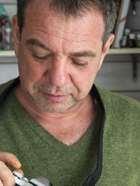 Close-up of mature man looking at camera