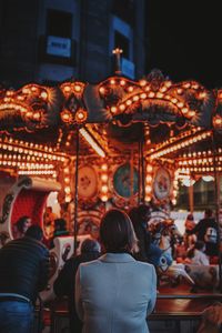 Rear view of people at amusement park