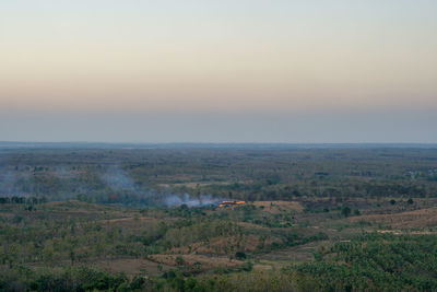 High angle view of land against sky during sunset