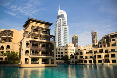 Low angle view of skyscrapers against sky in city