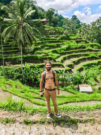 Full length portrait of man standing on field