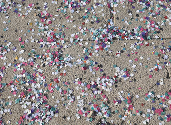 Background of many colored confetti on the floor