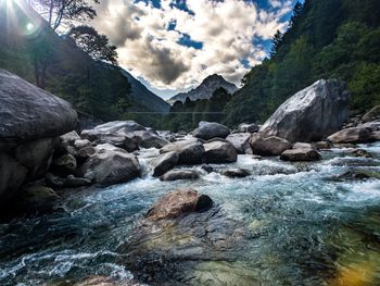 Scenic view of river flowing through rocks