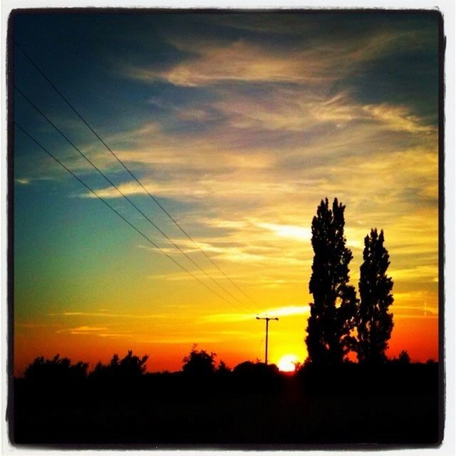 sunset, silhouette, power line, orange color, sky, electricity pylon, tree, scenics, power supply, beauty in nature, electricity, tranquility, tranquil scene, nature, transfer print, cable, connection, cloud - sky, low angle view, dramatic sky