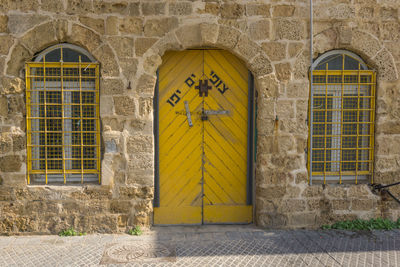 Yellow closed door of building