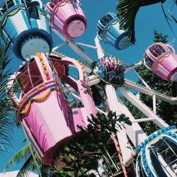 Low angle view of ferris wheel against sky