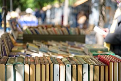 Close-up of books on shelf at market stall