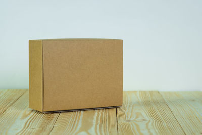 Close-up of paper on table against white background