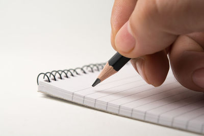 Close-up of human hand against white background