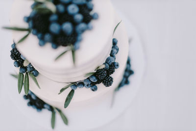 High angle view of fresh white cake on table