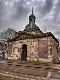 Facade of cathedral against dramatic sky