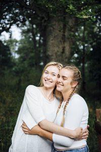 Two young women hugging