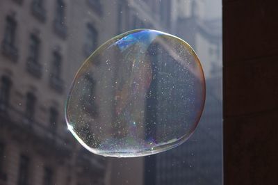 Close-up of water drop on window