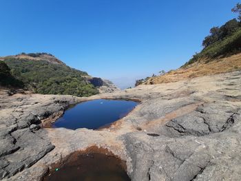 Scenic view of mountain against clear blue sky