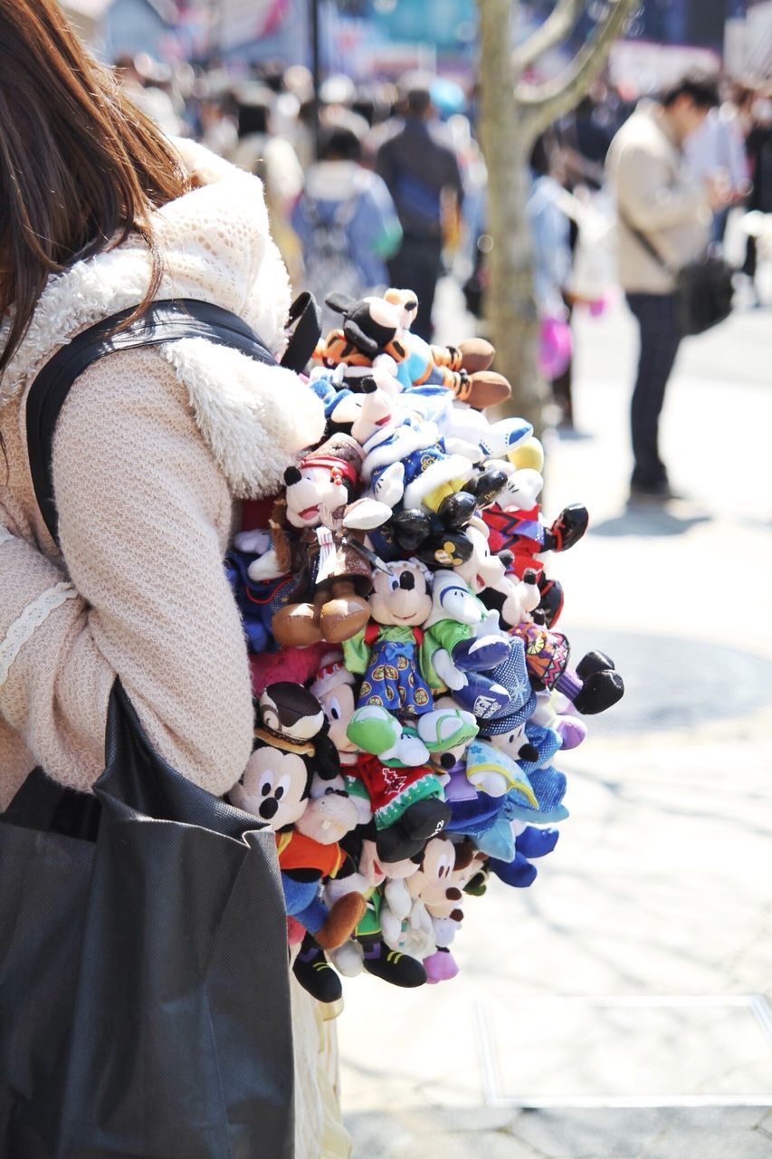 focus on foreground, incidental people, large group of objects, variation, close-up, retail, for sale, abundance, market, market stall, day, street, choice, selective focus, outdoors, art and craft, small business, cultures, hanging