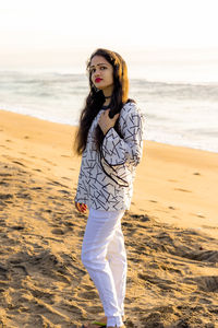 Young woman standing on beach