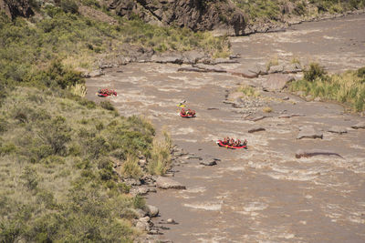 High angle view of people rafting in river