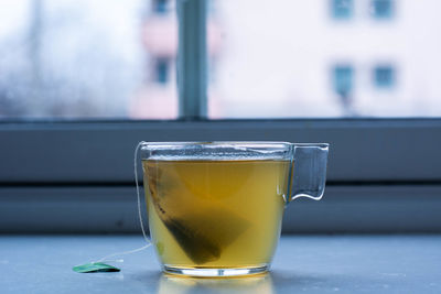 Close-up of tea in glass on table