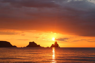 Scenic view of sea against orange sky