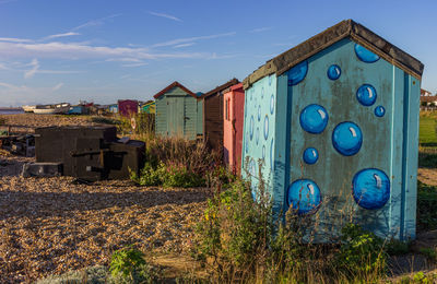 Abandoned buildings against blue sky