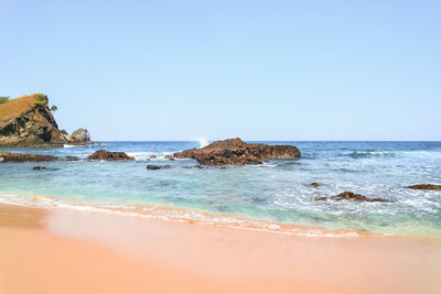 Scenic view of sea against clear sky