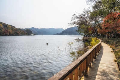 View of cheongpyeong lake taken from nami island with wooden deck trail. taken in south korea