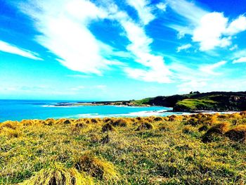 Scenic view of sea against cloudy sky