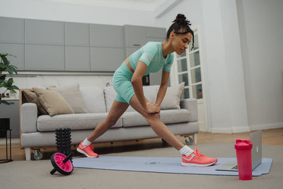Side view of man exercising in gym