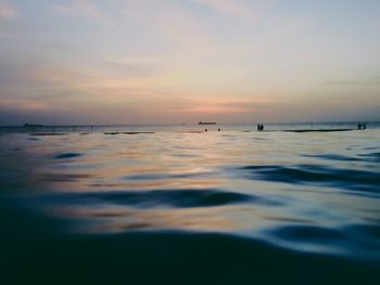 Scenic view of sea at sunset