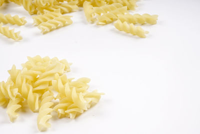 Close-up of chopped vegetables on white background