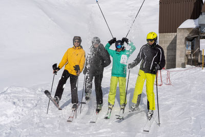 Group of people skiing on snowcapped mountain