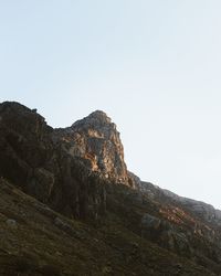 Low angle view of rock formation against clear sky