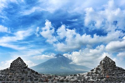 View of mountain range against cloudy sky