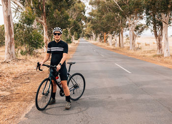 Man riding bicycle on road