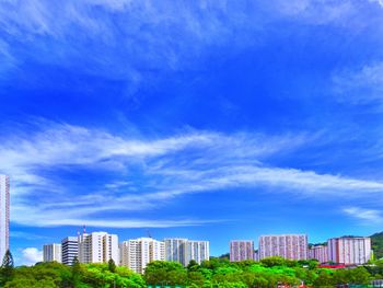 Buildings in city against sky