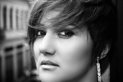 Close-up portrait of mid adult woman with short hair