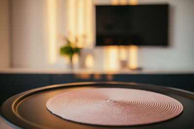 Close-up of electric lamp on table at home