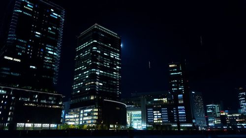 Low angle view of modern building at night