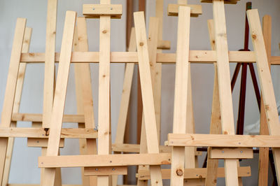 Empty wooden easel tripod for painting canvas