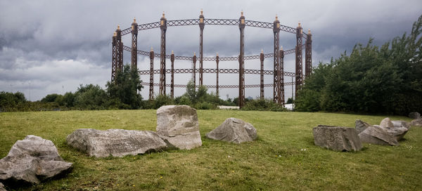 Built structure on field against sky