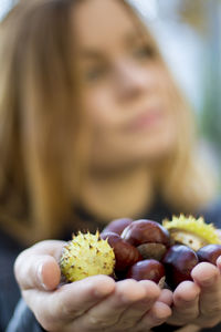 Close-up of woman holding fruit