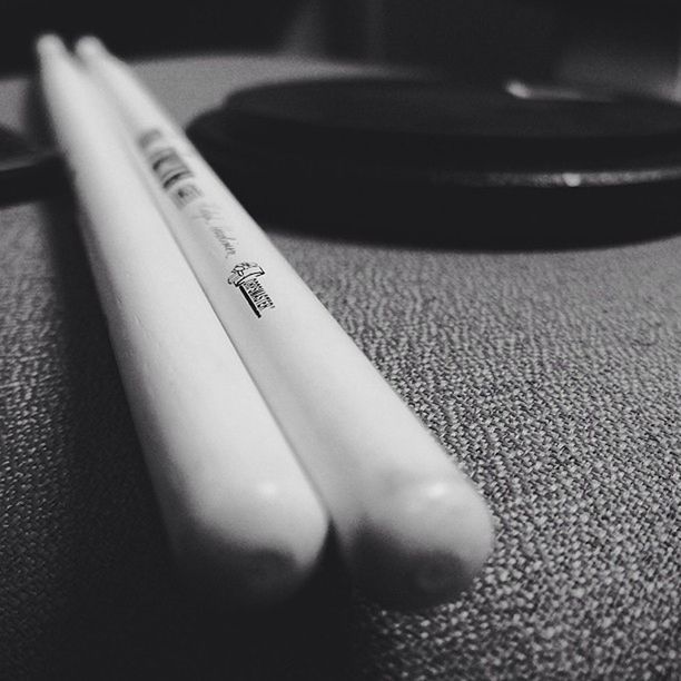 indoors, close-up, still life, technology, table, single object, high angle view, communication, metal, selective focus, focus on foreground, no people, part of, text, music, old-fashioned, equipment, connection, pen, retro styled