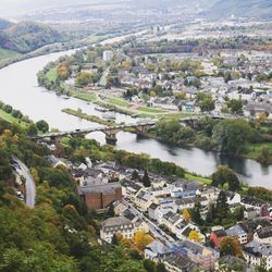 High angle view of river amidst buildings in town