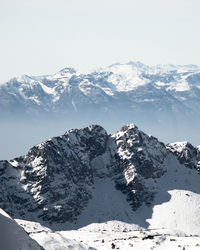 Scenic view of snowcapped mountains against sky