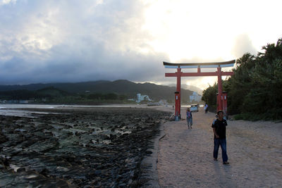 Rear view of people on beach