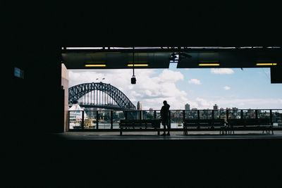 Sydney harbor bridge seen from building against sky