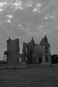 Built structure against cloudy sky