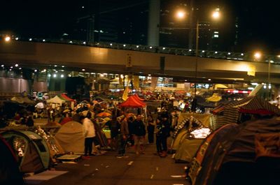 Crowd on illuminated city at night