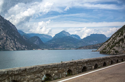 Scenic view of lake and mountains against sky at lake garda italy